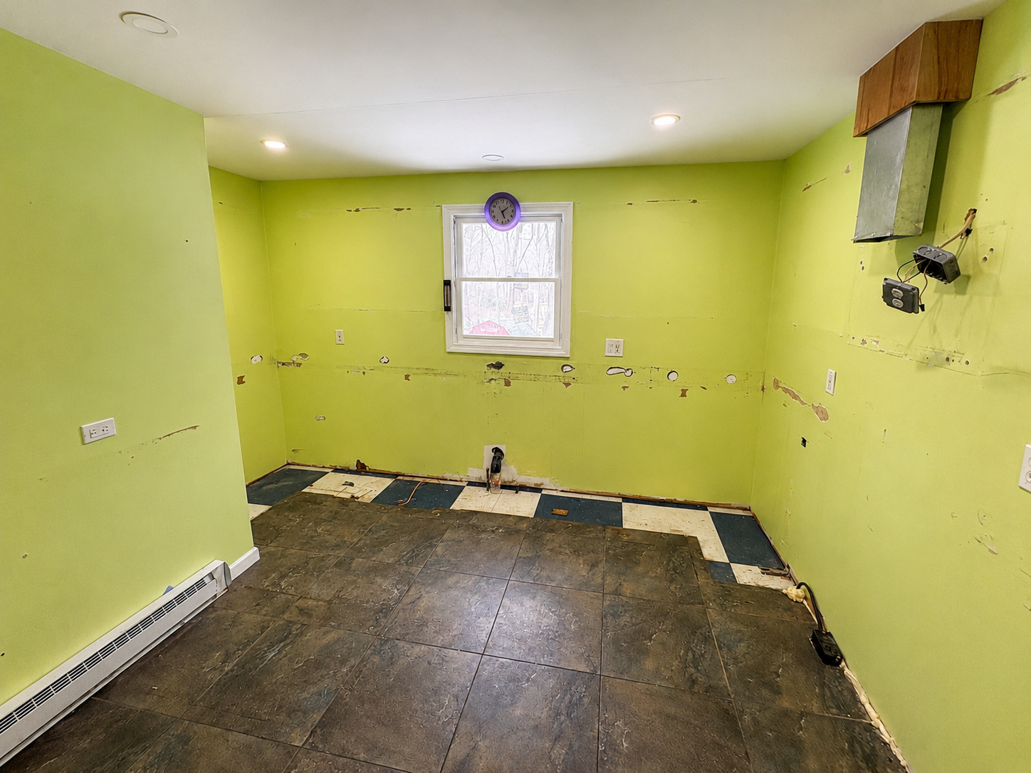 Kitchen stripped to bare walls